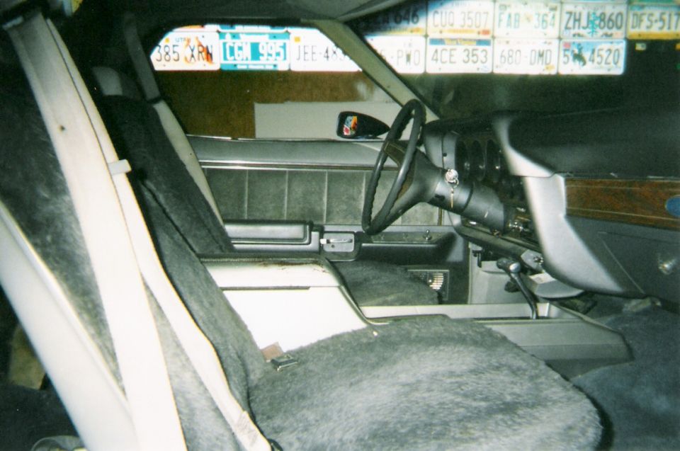 Buckets, floor shift, and consol. Designed for two only.