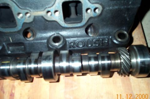 1996 Ford Bronco - Close-up of a ROUSH branded engine block with a camshaft in the foreground.