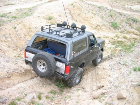 1988 Ford Bronco - This 1988 Ford Bronco is navigating a sandy, off-road path.