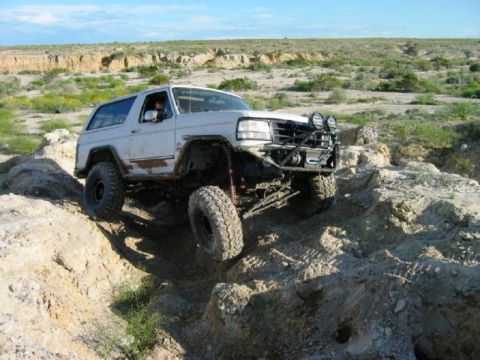 1988 Ford Bronco - This 1988 Ford Bronco navigates a challenging rocky obstacle on an off-road course.