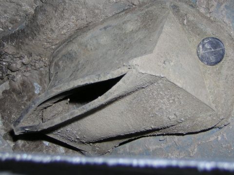 1995 Ford Bronco - Close-up of a dirty air vent, likely from a vehicle's interior or undercarriage.