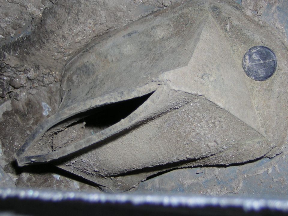 dusty plastic air vent with a circular cap on the right