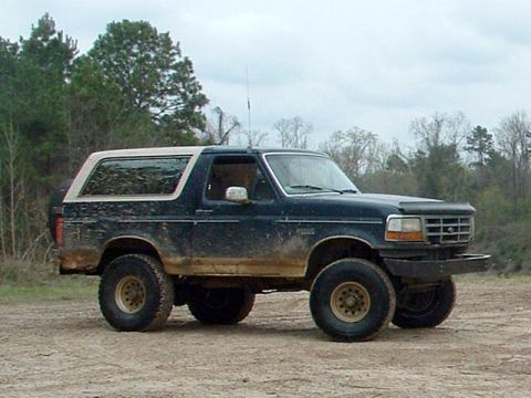 1993 Ford Bronco - This 1993 Ford Bronco is shown in a three-quarter front view, its dark blue body and white removable top.