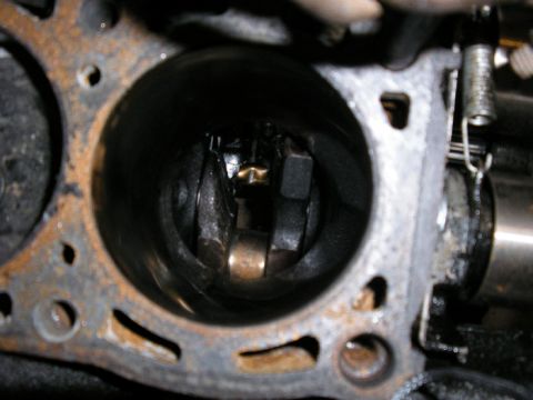 1990 Ford Probe - Engine cylinder head detail showing a bore for a piston.