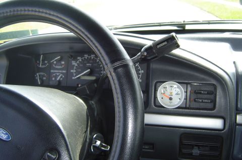 1993 Ford Bronco - Interior view of a 1993 Ford Bronco dashboard, showing the steering wheel, gauges, and gear selector.