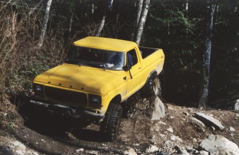 1990 Ford Bronco - This yellow 1979 Ford F-150 navigates a challenging rocky terrain.