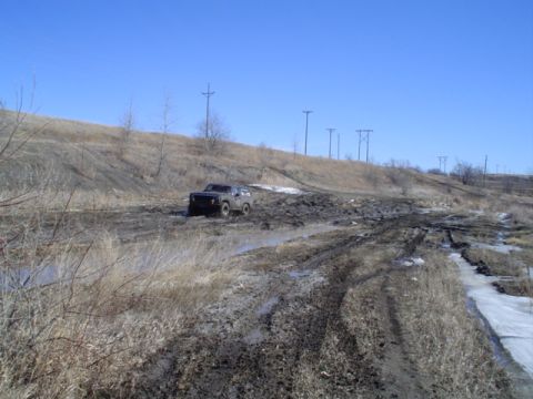 1981 Ford Bronco - This 1981 Ford Bronco is shown off-roading through a challenging muddy terrain.