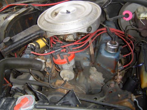 1979 Ford Bronco - Close-up view of an engine compartment, showing various components and wiring.