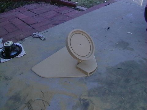 1999 Ford Taurus - A custom car speaker enclosure and a separate speaker are shown on a concrete surface, with a portion of a vehicle visible.