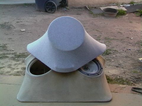 1999 Ford Taurus - A custom-built speaker enclosure, likely for a car interior, is shown with two subwoofers installed.