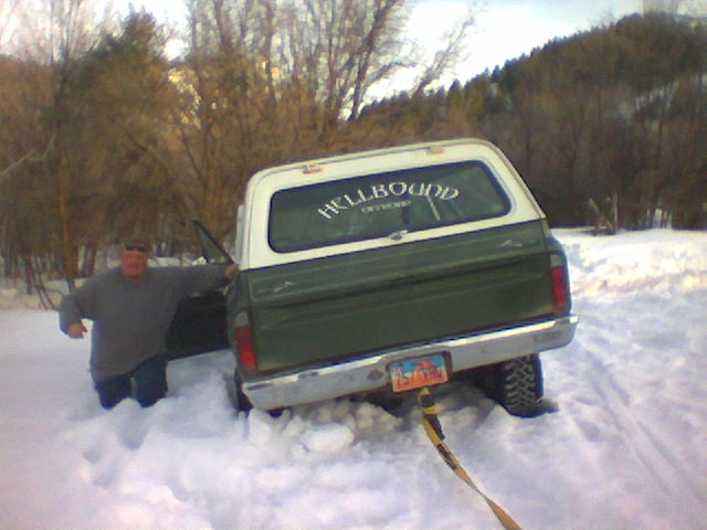 James next to his Blazer in all most waist high snow.
