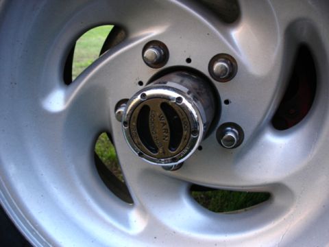 1987 Ford Bronco - A WARN locking hub is visible on the wheel of a vehicle, with the words "FREE" and "LOCK" clearly marked.