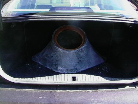 1999 Ford Taurus - Large conical object placed inside the trunk of a car.