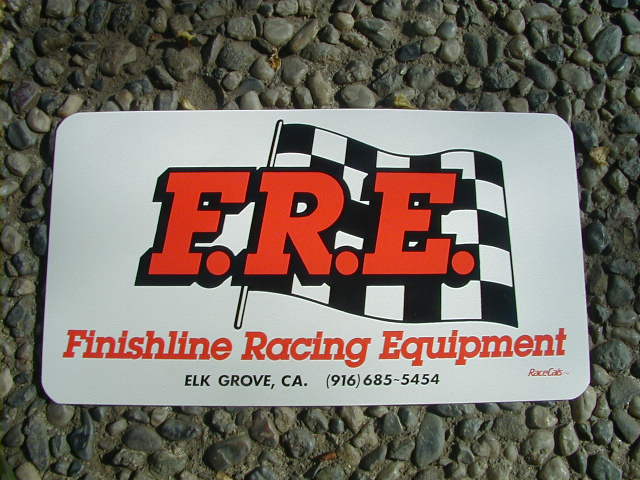 Finishline Racing Equipment sign with checkered flag and phone number
