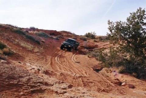1996 Ford Bronco - I was first down this sandy wash. Notice my tire tracks, thought I was going to flop over into the gulley. It was raining on and off and th…