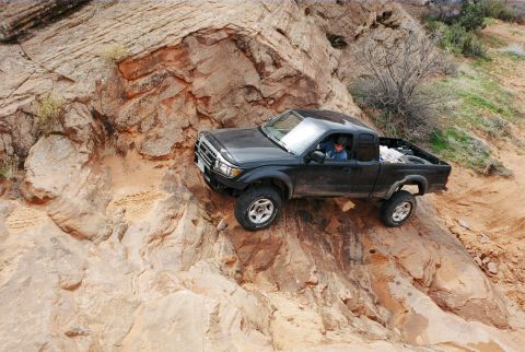 1996 Ford Bronco - Up and over the first part now he is looking for my tire tracks (MTR's just ahead of him in the sand).