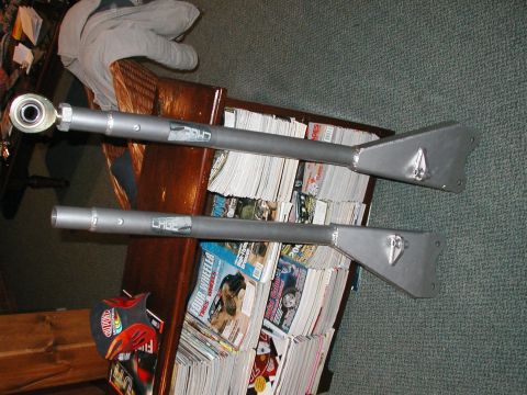 1994 Ford Bronco - Aftermarket suspension control arms are shown, with "CAGE" branding visible on each.