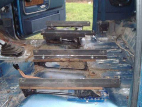 1984 Ford Bronco - View from driver's side of angle iron mounted to factory seat brackets