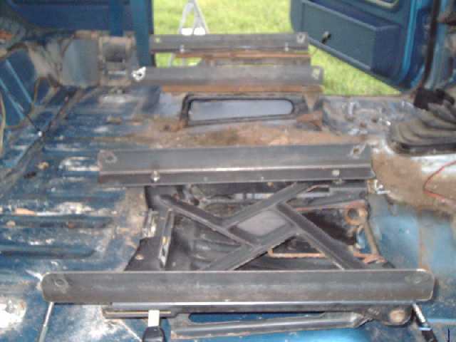 passngr-side view of angle iron mounted to factory seat brackets.