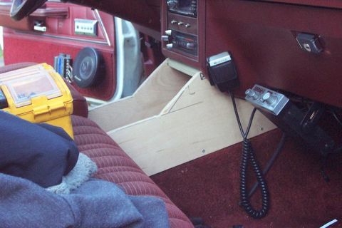 1985 Ford Crown Victoria LTD - A custom wooden console is installed in the interior of a vehicle, holding a CB radio and microphone.