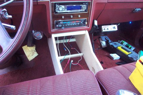 1985 Ford Crown Victoria LTD - Custom console installation in a 1985 Ford Crown Victoria LTD, with wiring and accessories visible.