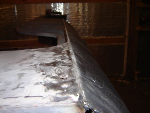 1992 Ford Bronco - Unidentified metal part showing signs of welding and repair work.