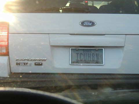 1994 Ford Probe - White Ford Explorer XLT with Iowa license plate ICUH8N.