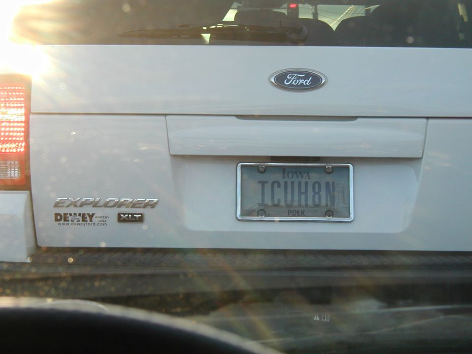 Rear of a white Ford Explorer XLT with an Iowa license plate