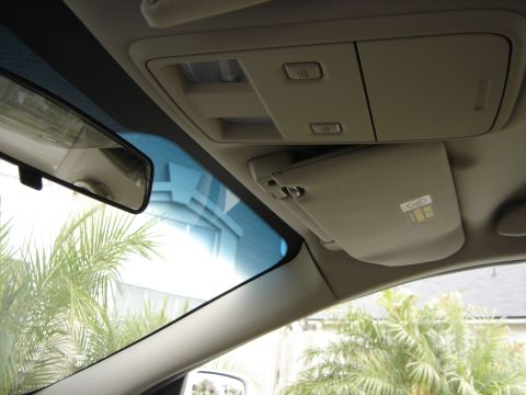 2002 Lincoln Town Car - The interior of a car is visible, including the rearview mirror and overhead console.