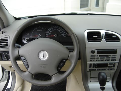 2002 Lincoln Town Car - Interior view of a 2002 Lincoln Town Car, highlighting the dashboard and steering wheel details.