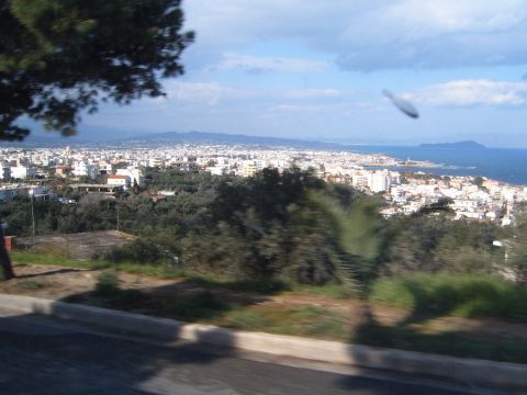 1988 Ford Bronco - Panoramic view of a coastal city with buildings reaching towards the sea.