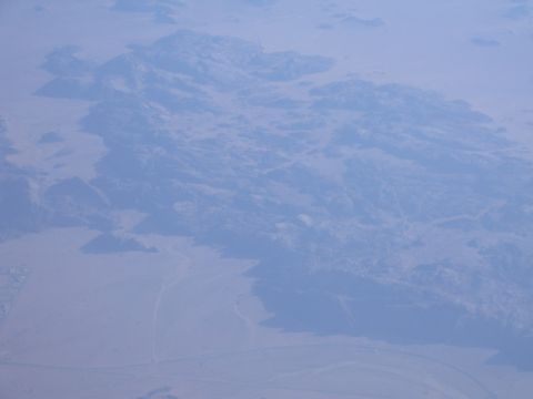 1988 Ford Bronco - Aerial view of mountains and desert landscape. Supermotors.net watermark visible.