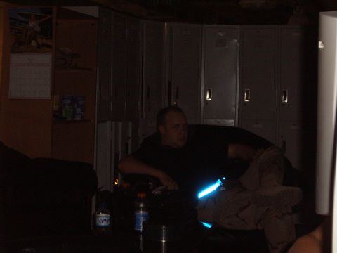 1988 Ford Bronco - A man is seen in a dimly lit room with lockers in the background. The Supermotors logo is visible in the lower right corner.