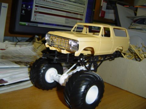 1979 Ford Bronco - A model of a truck is shown on a desk with a computer monitor in the background.
