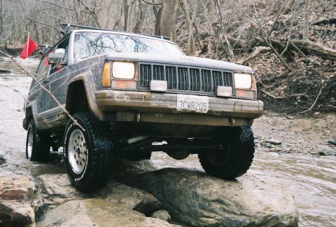 1995 Ford Bronco - This Jeep Cherokee XJ is shown off-roading through a rocky stream bed.
