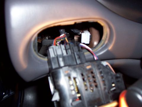 1999 Ford Taurus - first pop the switch out with a flat head screw driver, and pull it out. you'll see it's like this, three harnesses plugged into it. unplug…