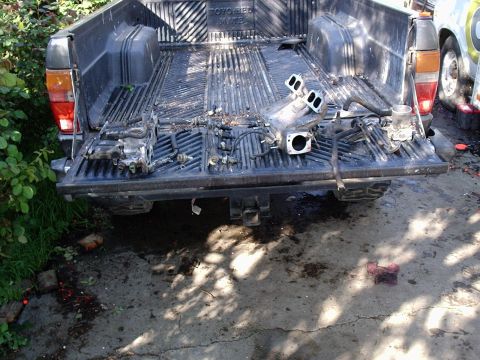 1986 Toyota Pickup/SR5 - here is my dirty old intake sitting on my tailgate in bits and pieces.