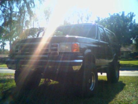 1990 Ford Bronco - This lifted Ford Bronco has a distinctive front grille and body style consistent with the late 1980s model years.