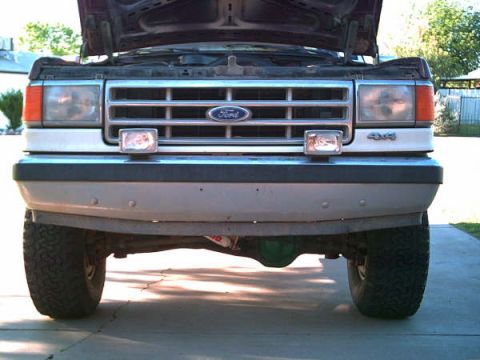 1988 Ford Bronco - KC lights on front bumper. Rancho dual steering stab.