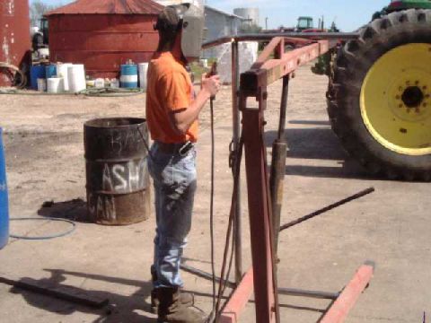 1984 Ford Bronco - I used an engine hoist to spread the legs of the main hoop. Completed the welds after measuring and checking square w/ main hoop.