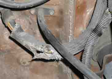 1988 Ford Bronco - Close-up of a damaged wiring harness, showing frayed insulation and exposed wires.