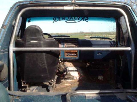 1984 Ford Bronco - Main hoop & seat crossmember mounted to floor plates.Still need to mount the frame supports.
