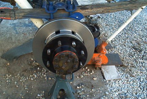 1986 Ford Bronco - Put the rotor on the hub reusing the lugs if you are cheap like me.
