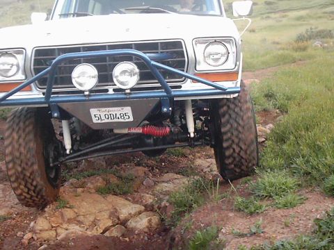 1978 Ford Bronco - 1978 Ford Bronco navigating rough off-road conditions.