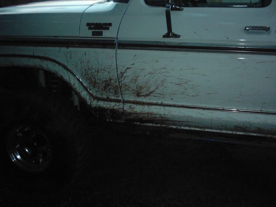Side view of muddy 1978 Ford Bronco