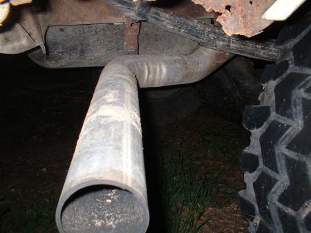 1978 Ford Bronco - Exhaust pipe and tire tread detail. Supermotors.net logo is present in the corner.