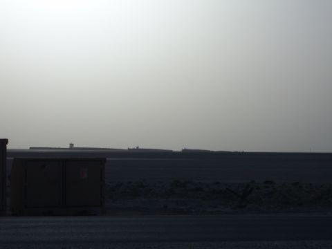 1988 Ford Bronco - Utility boxes are visible in the foreground with a hazy landscape in the background.
