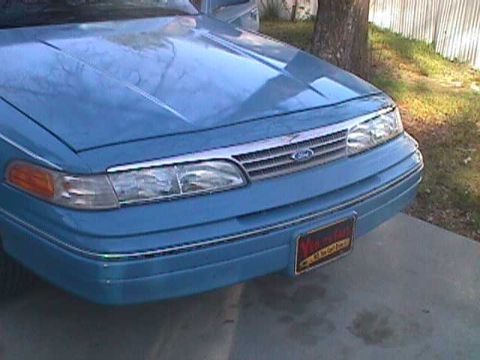 1994 Ford Crown Victoria - Front view of a blue 1994 Ford Crown Victoria showing the grille and headlights.