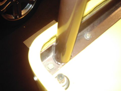 1978 Ford Bronco - Interior roll bar mount detail, yellow and brown colors visible.