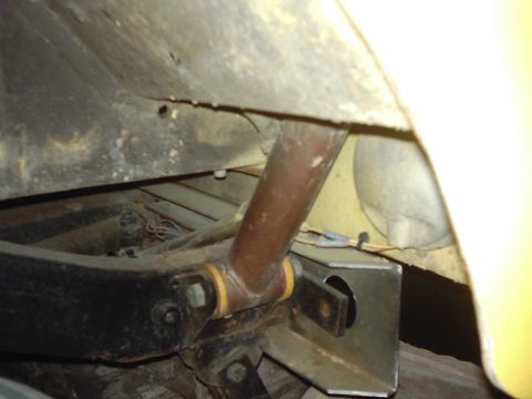 1978 Ford Bronco - This image shows a close-up view of a vehicle's suspension system, focusing on the shock absorber and related components.